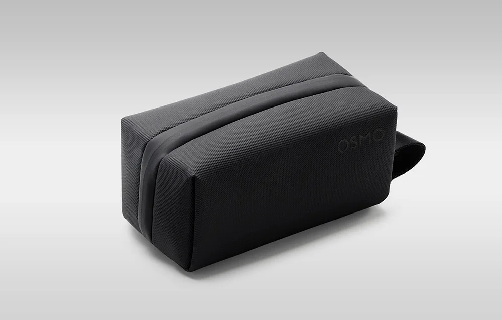 Closed black DJI Osmo carrying case with textured surface, zipper, and side handle
