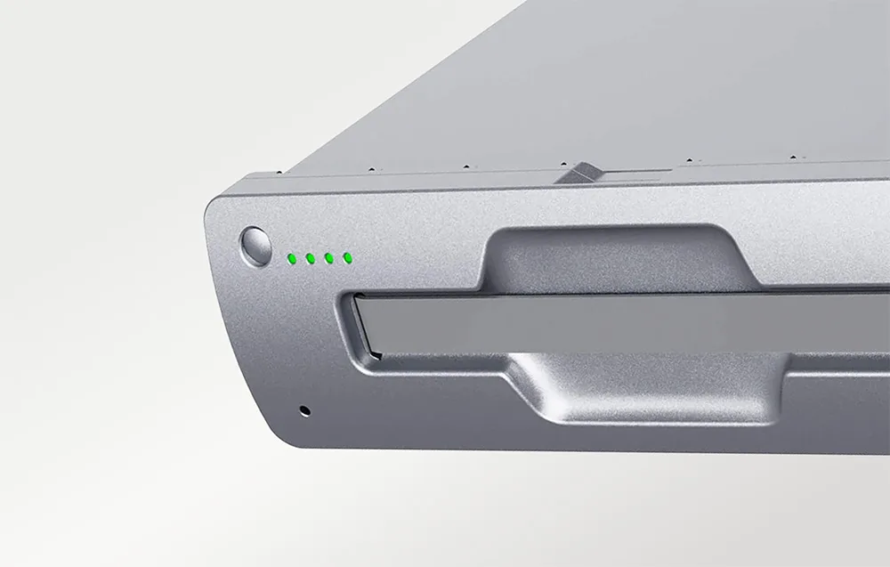 Close-up of the front panel of a silver UNITREE battery with green LED indicators