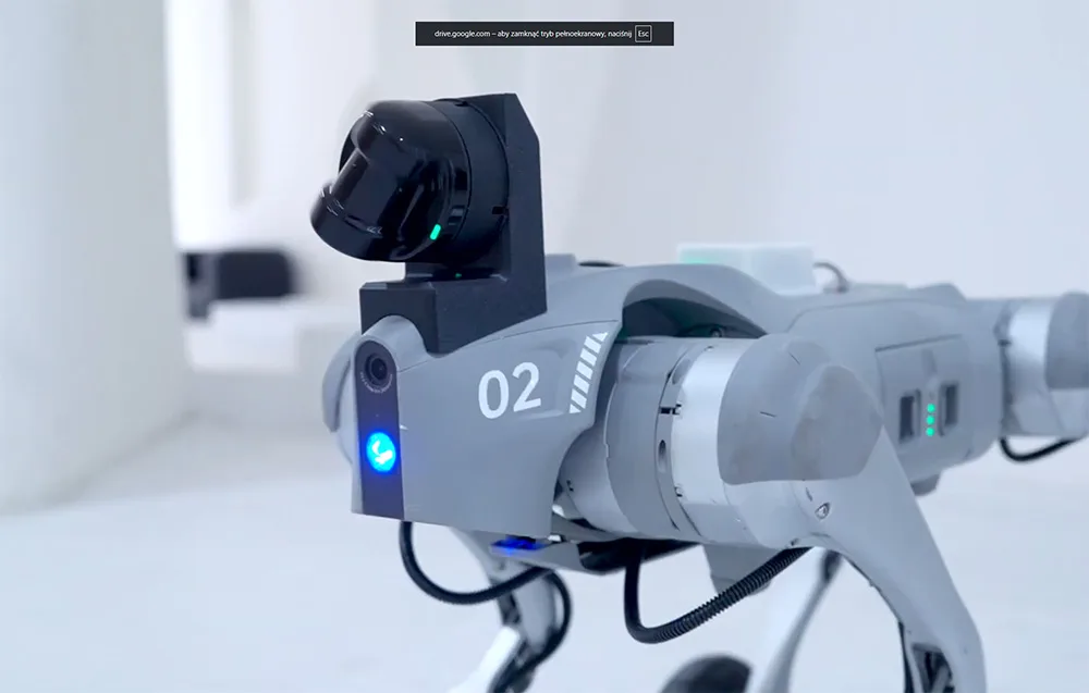 Close-up of a black LiDAR sensor with LED lights mounted on a robot
