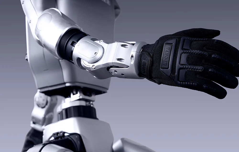 Close-up of the UNITREE robot mechanical arm fitted with a black protective glove