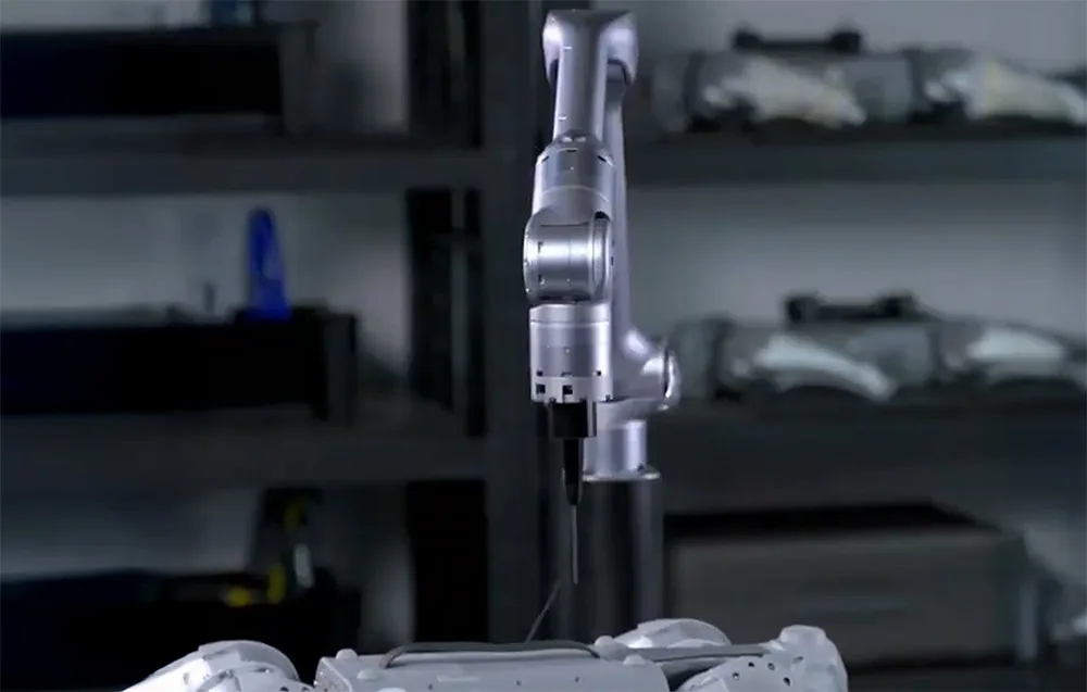 UNITREE Z1 Pro robotic arm performing precise operations above a mechanical assembly in a workshop