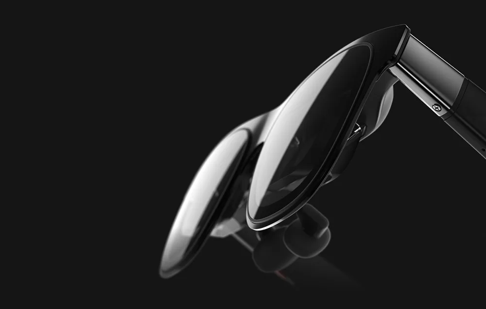 Темні AR-окуляри XREAL One Pro на чорному тлі