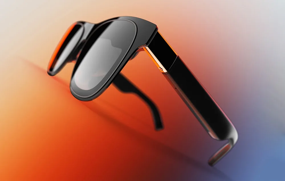 Чорні AR-окуляри XREAL One Pro на яскравому кольоровому тлі