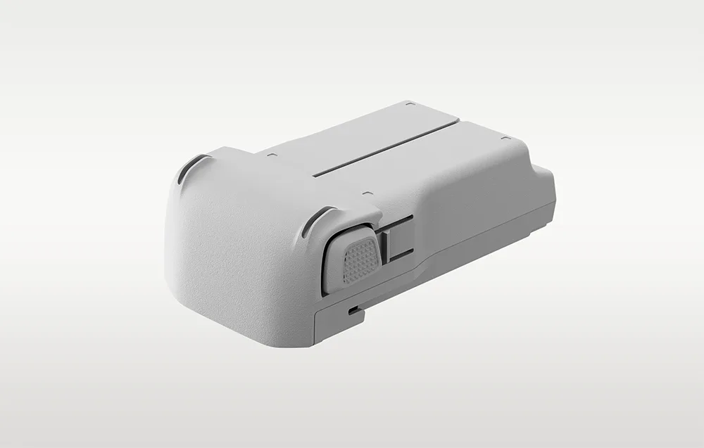 Light gray DJI Lito X1 Plus drone battery with a textured release button shown from the side