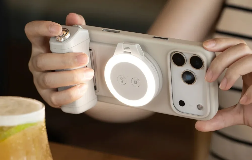 Smartphone with PGYTech MagCam 2 grip and LED ring light during photography