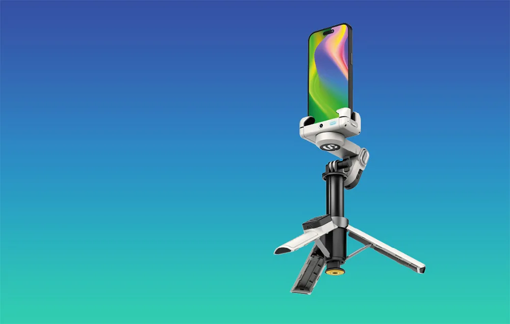 White AOCHUAN M3 Pro Mini gimbal with a smartphone mounted on the unfolded mini tripod on a blue turquoise background.