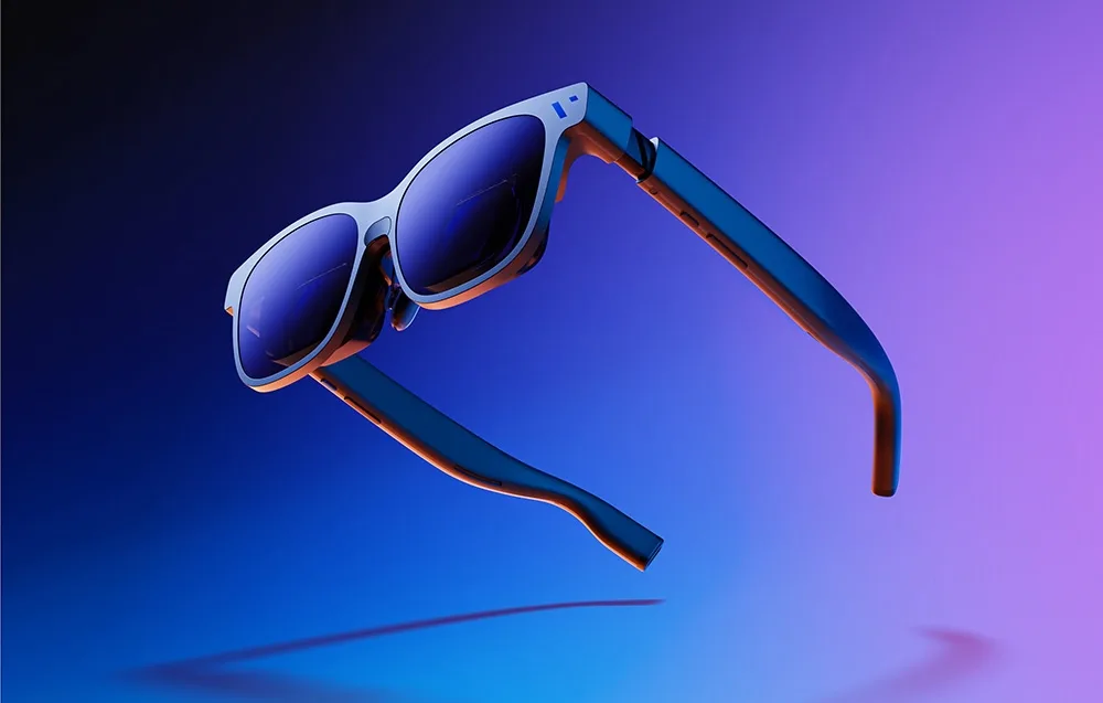VITURE XR Beast smart glasses in black floating against a purple and blue gradient background.