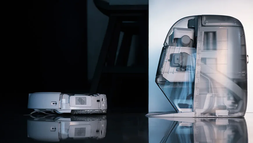 DJI ROMO robot vacuum approaching the docking station shown in side cross-section view